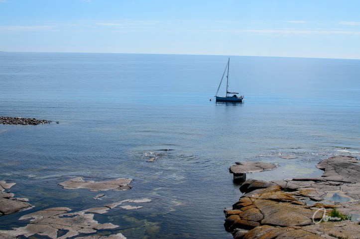 View of moored boat off the lighthouse island