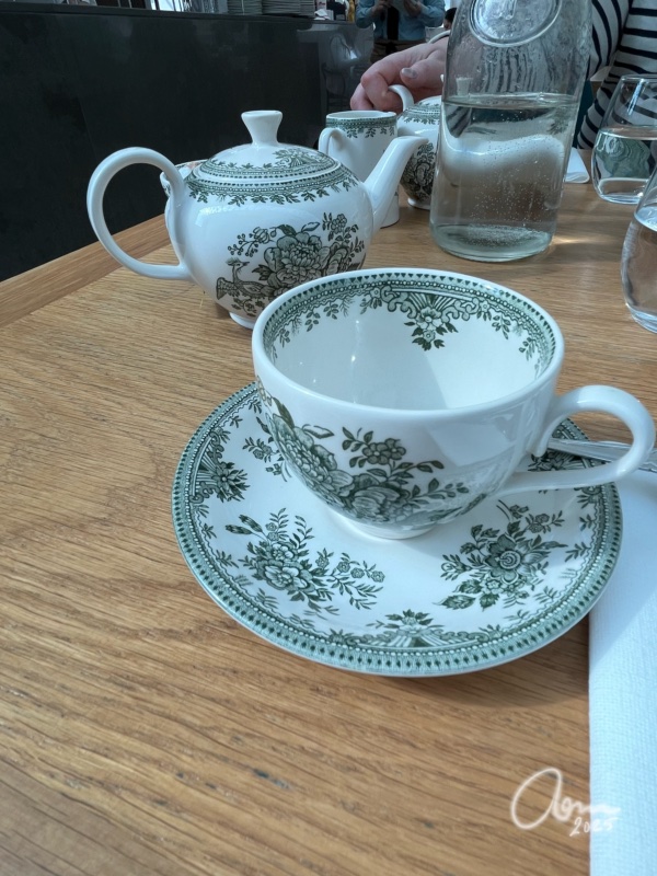 Tea cup and pot with intricate painting